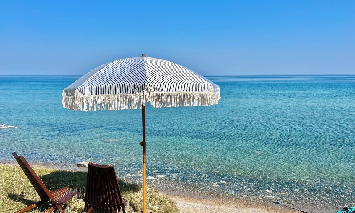Cheboygan Cottage | 125 ft of Private BEACHFRONT with large, secluded yard & spectacular views!