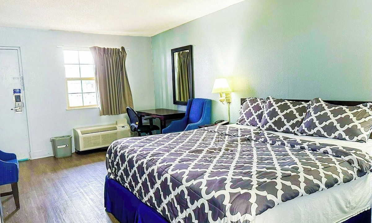 Madisonville Hotel | Convenient Room with King Bed and Microwave and Fridge for a Comfortable Stay