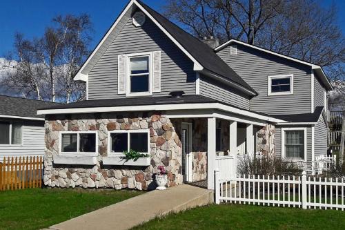 Beulah House | Elegant Stone Cottage: Steps to Crystal Lake Beach