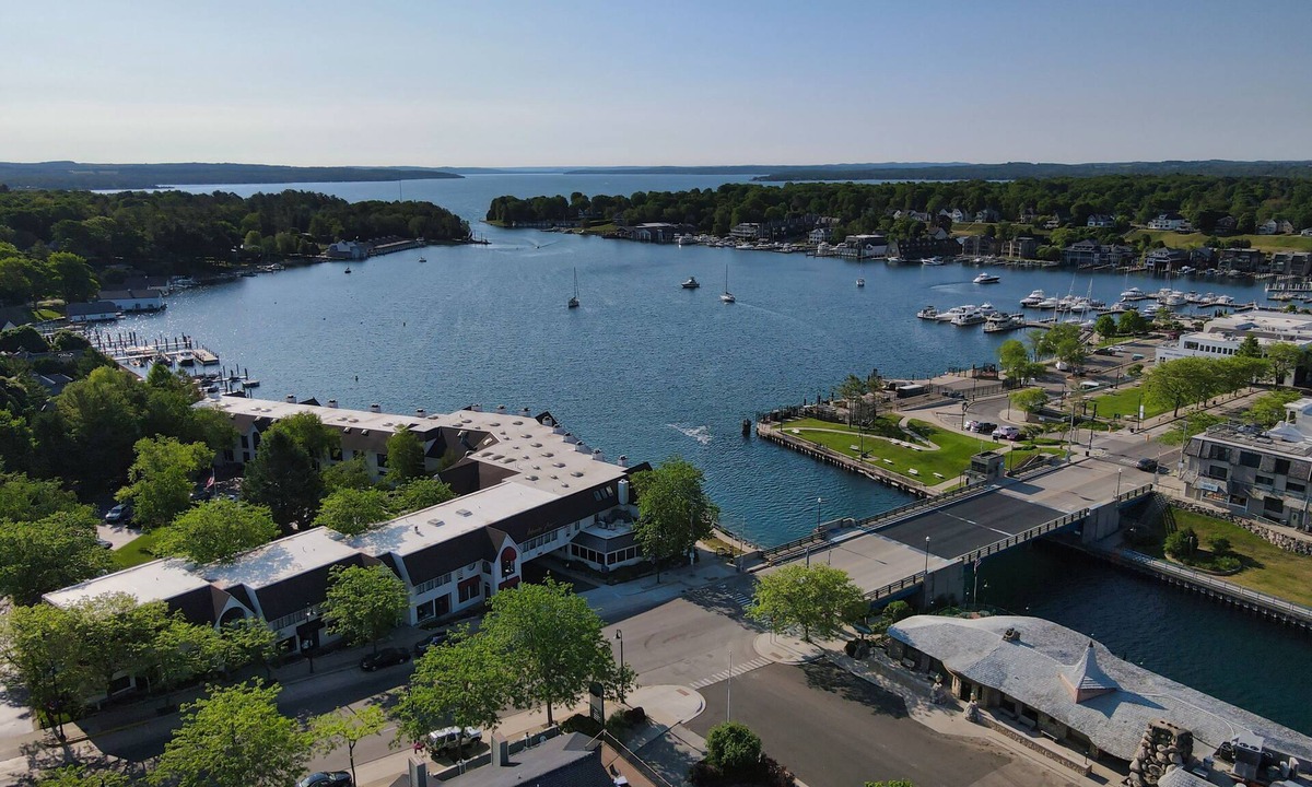 Charlevoix Condo | EWI 116 Lake Charlevoix Views | Pool, Hot Tub, Sauna | Fireplace