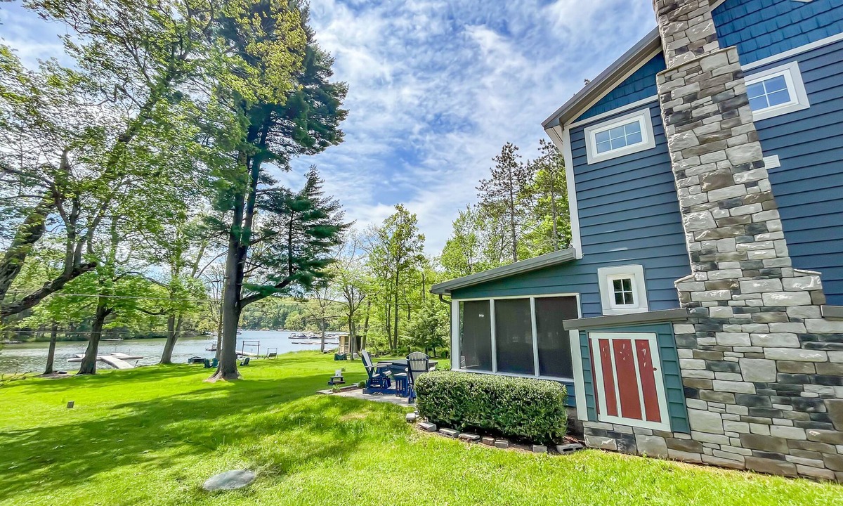 North Glade Hills House | Iconic Lakefront Cottage with Hot Tub and Dock! Pet friendly