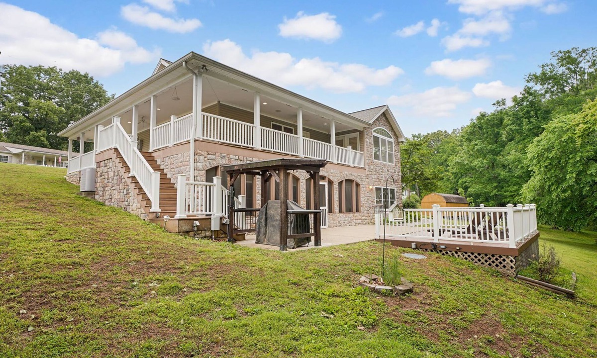 Cadiz House | Lakefront Retreat with private dock, game room, bar, and sunroom views