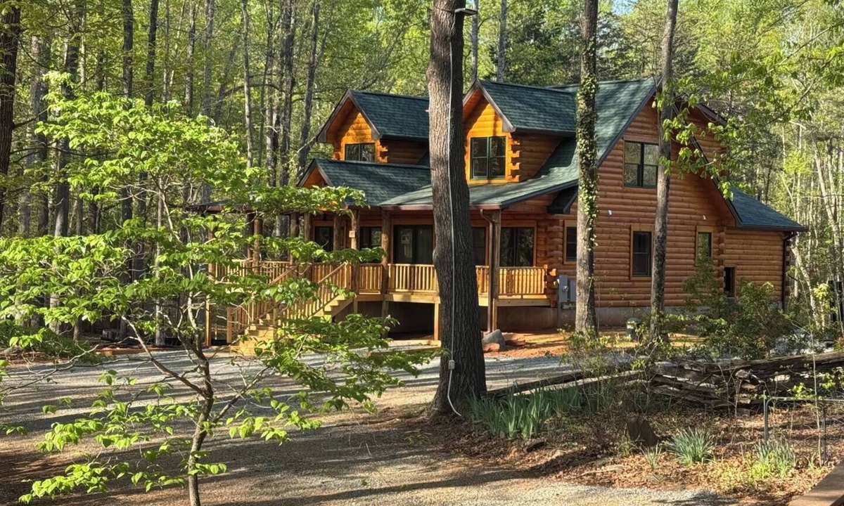 Union Hall Cabin | Main Channel Lots of Water-All Decked Out — new lakefront log home on Smith Mountain Lake with a private hot tub, 50+ ft of wraparound deck, fire pit patio & easy lake access. Two full kitchens. One of 5 cabins on an 8-acre lakefront micro-resort.