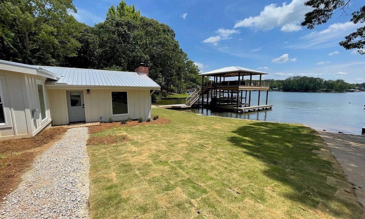Dadeville Cabin | Newly renovated lakefront cabin at Lake Martin! Dock and boat ramp onsite!
