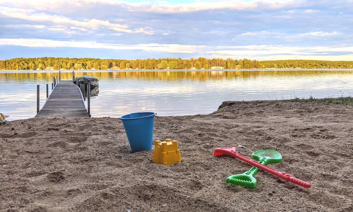 Gaylord House | Private Lake Front, Fire Pit, Grill, Backyard, AC, Hot Tub