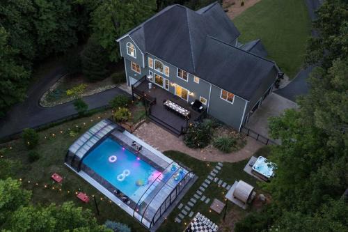 Candler House | Spacious 6 Bedroom Home with a Heated Salt Water Pool, Theater & Game Room