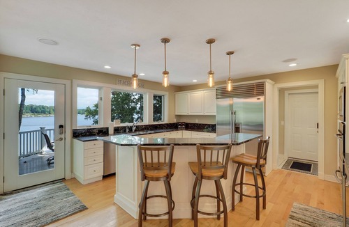 Traverse City House | 111’ of Sandy Beach Frontage on Long Lake | Hot Tub | Private Dock | Kayaks