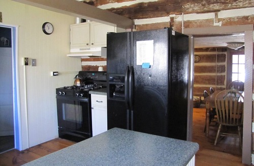 Hendersonville Cabin | 1800s Log Cabin with modern amenities conveniently located.