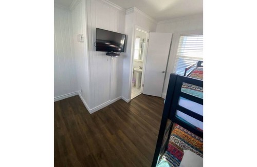 Ludington Apartment | Avenue Flats #1 - Walk to shops and restaurants - Hosted by Simple Lyfe Stays