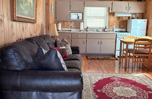Rabun Gap Cabin | Bear Cave Cabin is perched on a hilltop overlooking Valley Springs lake