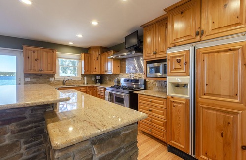 Suttons Bay House | Beautiful Beach Front Home on Suttons Bay w/Sunset Views. Sleeps 10.