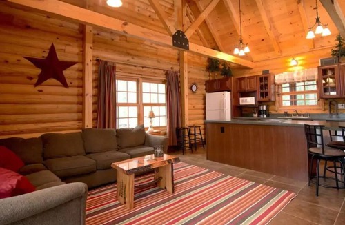 Ludington Cabin | Beautiful log cabin just minutes from the beach!