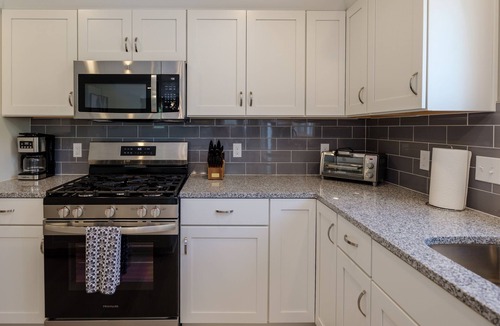 South Haven House | Beautiful new 6 bedroom with heated pool, fire pit and private setting