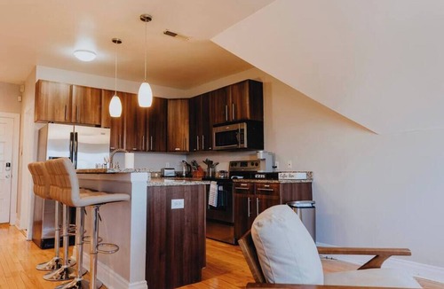 The Gate Apartment | Charming 1BR Retreat Opposite SSM SLU Hospital with Private Parking & Balcony