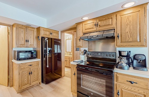 Conover House | Charming lakefront home with dock, fireplace, streaming, lake views, W/D, & AC