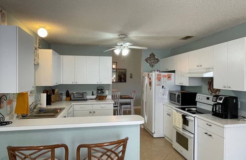 Lady Lake House | Charming Retreat with Lanai & Preserve Views, Golf Cart Included!
