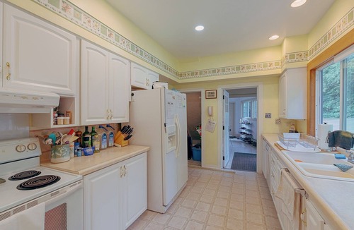 Lake Leelanau Cottage | Classic 1920 cottage, huge lot, loads of parking, boat dock, fire pit, private.