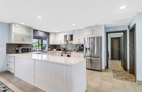 Yacht Club Villa | Coastal Paradise 1013 Modern European Style Waterfront Home w/Gourmet Kitchen & heated Pool