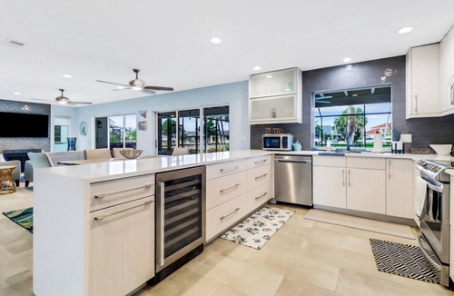 Yacht Club Villa | Coastal Paradise 1013 Modern European Style Waterfront Home w/Gourmet Kitchen & heated Pool