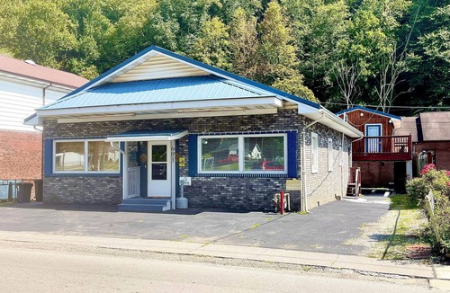 Kistler House | Cozy 4-bedroom house in Man w WiFi, arcade game, and extra parking. Near trails.