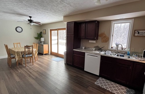 East Jordan House | Cozy 4br 3 bath home with acreage and a creek just minutes from Boyne Mountain