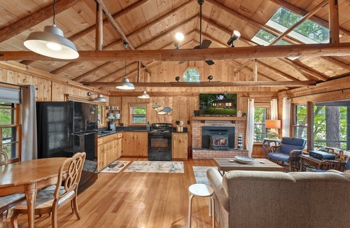 Le Roy Cabin | Cozy log cabin on Lake, fireplace, bonfire, kayaks, dock, orv trails, and grill,