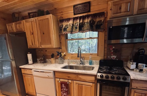 Gatlinburg - Pigeon Forge Cabin | Cozy Romantic cabin near Pigeon Forge Fireplace:Hot tub and Heart shaped tub!