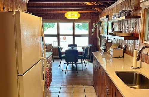 Traverse City Cottage | Cozy Traverse City Lake House: Hot Tub, Kayaks, Private Frontage & Sunset Views