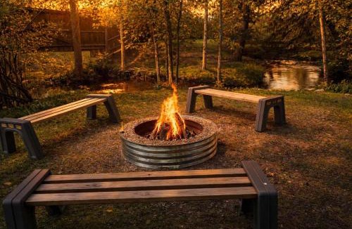 Traverse City House | Creekside Hot Tub-Walk to Beach-Uniquely Northern