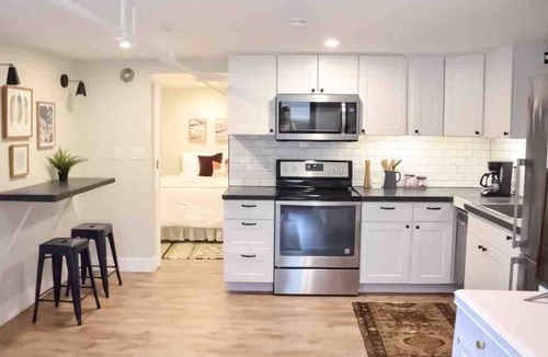 Evansville Apartment | Digs 5 of 5: 1BDRM Open & Airy Garden Suite with Private Parking & More!