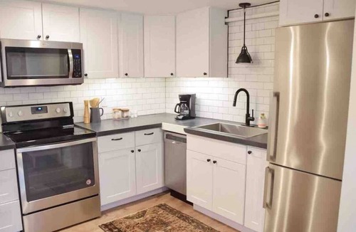 Evansville Apartment | Digs 5 of 5: 1BDRM Open & Airy Garden Suite with Private Parking & More!