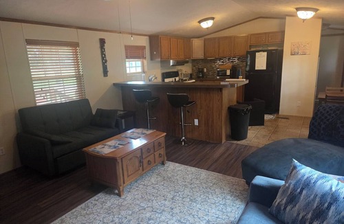 Cisne House | Enjoyable 2-bedroom mobile home with AC in charming Cisne. Quiet neighborhood.
