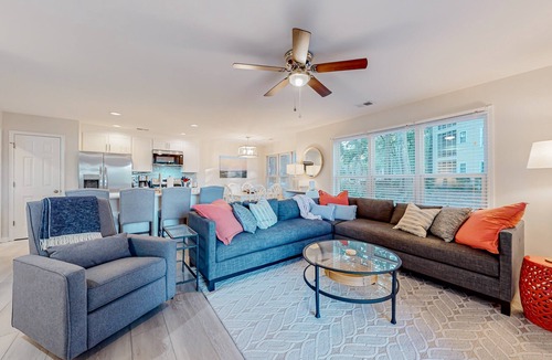 Sea Trail Condo | Ev's Escape,201A: Modern condo with sunroom - dog and snowbird-friendly