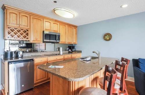 Charlevoix Condo | EWI 116 Lake Charlevoix Views | Pool, Hot Tub, Sauna | Fireplace