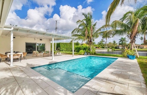 Lake Clarke Shores House | Fully upgraded waterfront pool home, centrally located in West Palm Beach!