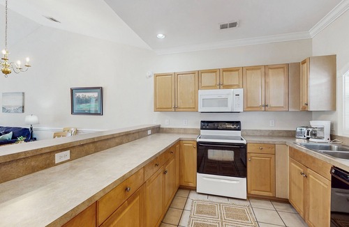 Central Myrtle Beach Condo | Golf course view condo with private balcony, W/D, pool & close to beach
