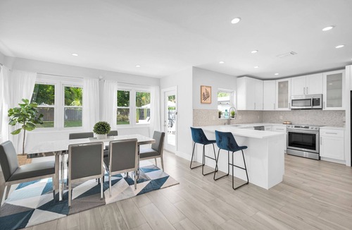 Poinsettia Heights Villa | Heated pool, 2 miles from Beach! Updated home: BBQ, large backyard, comfy beds