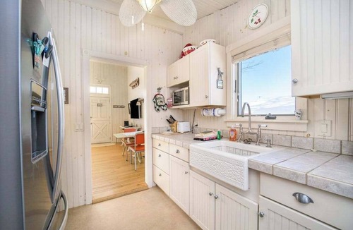 Walloon Lake House | Historic cozy cottage in Walloon Lake village close to Boyne Mountain skiing!