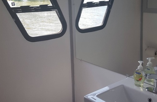 Coopersville Boat Rental | Houseboat on Grand River on private wooded lot