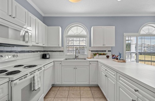 Central Myrtle Beach Apartment | Impeccable Golf View- 4 BDs- Pools - Near Broadway