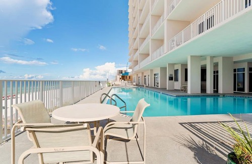 Ono Island Apartment | Inviting Gulf-front condo In Perdido Key with waterfront pool hot tub and oceanfront balcony