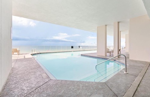 Ono Island Apartment | Inviting Gulf-front condo In Perdido Key with waterfront pool hot tub and oceanfront balcony