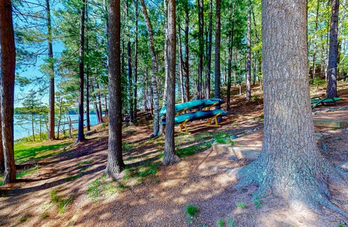 Boulder Junction Cabin | Lakefront cabin with private dock, boat, firepit, fish cleaning house, fireplace
