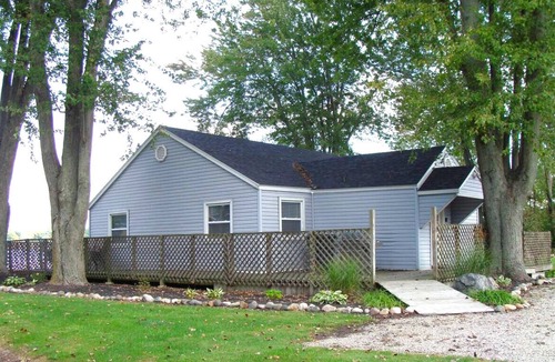 Coldwater House | Lakefront home w/Sunroom beach, kayaks, dock and laundry. 4 bd. Pet Friendly!