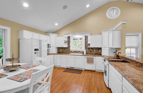 Cadiz House | Lakefront Retreat with private dock, game room, bar, and sunroom views