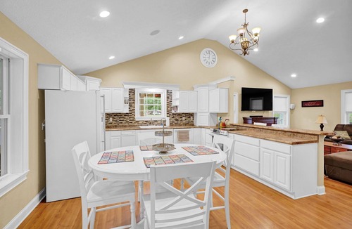Cadiz House | Lakefront Retreat with private dock, game room, bar, and sunroom views