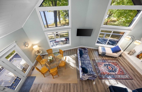 Gaylord Cottage | Lakefront Spacious Cottage with Sandy Beach, Kayaks and Games!