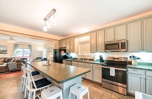 Orange House | Lakeside retreat with a firepit, dock, deck, hot tub, pool table - dog friendly