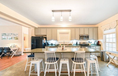 Orange House | Lakeside retreat with a firepit, dock, deck, hot tub, pool table - dog friendly