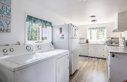 Traverse City Cottage | Long Lake Stone Cottage in Traverse City Frontage Kayaks Fire Pit Pet friendly
